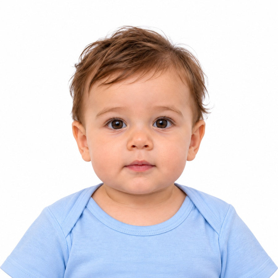 A finished US passport photo of a baby boy on a plain white background, with its measurements marked
