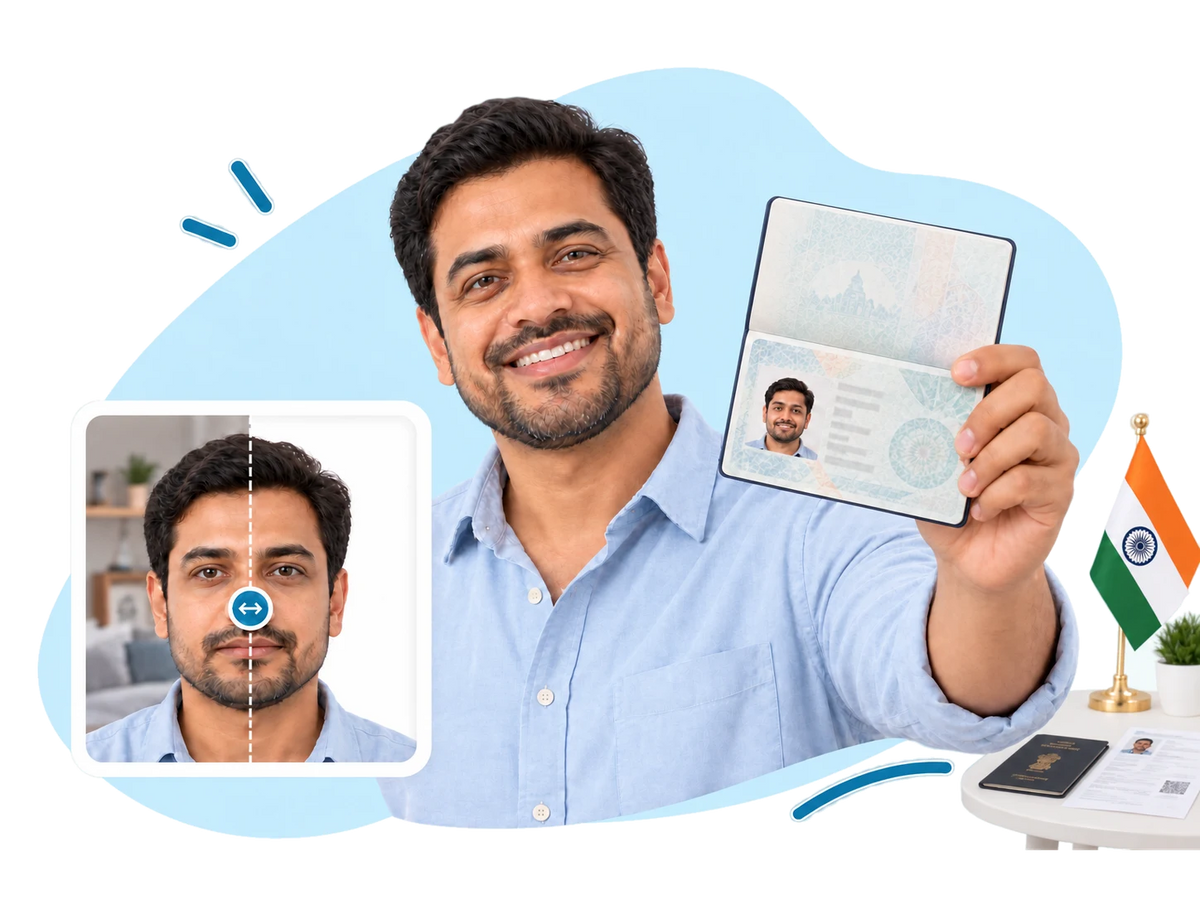 A smiling man holding up his OCI booklet open at his photo, with his Indian passport and a printed e-Visa on the table beside an Indian flag