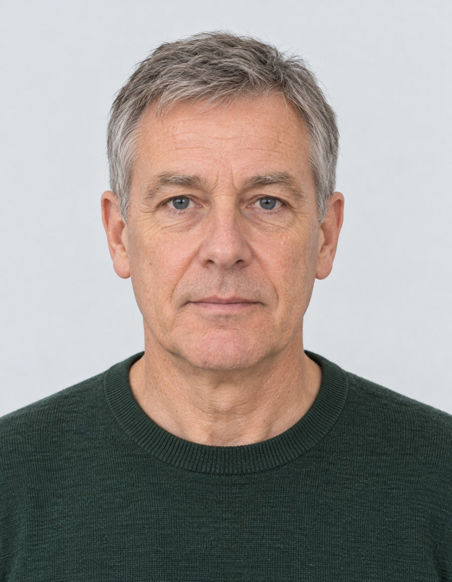 A finished photo of a man showing his head, shoulders and upper body on a plain light background, with its measurements marked