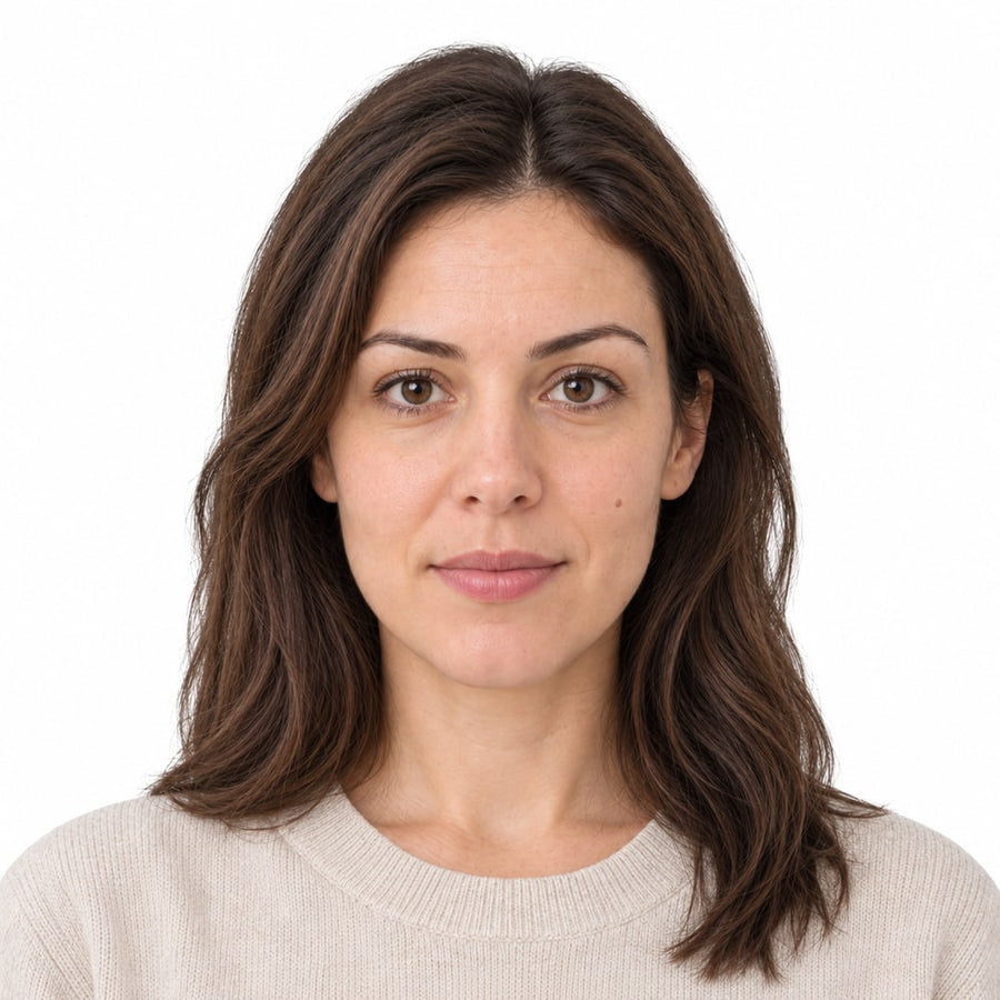 A finished 2 x 2 photo of a woman on a plain white background, with its measurements marked